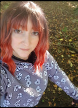 Load image into Gallery viewer, lady wears grey cropped hooded top with hearts on that have cobwebs inside
